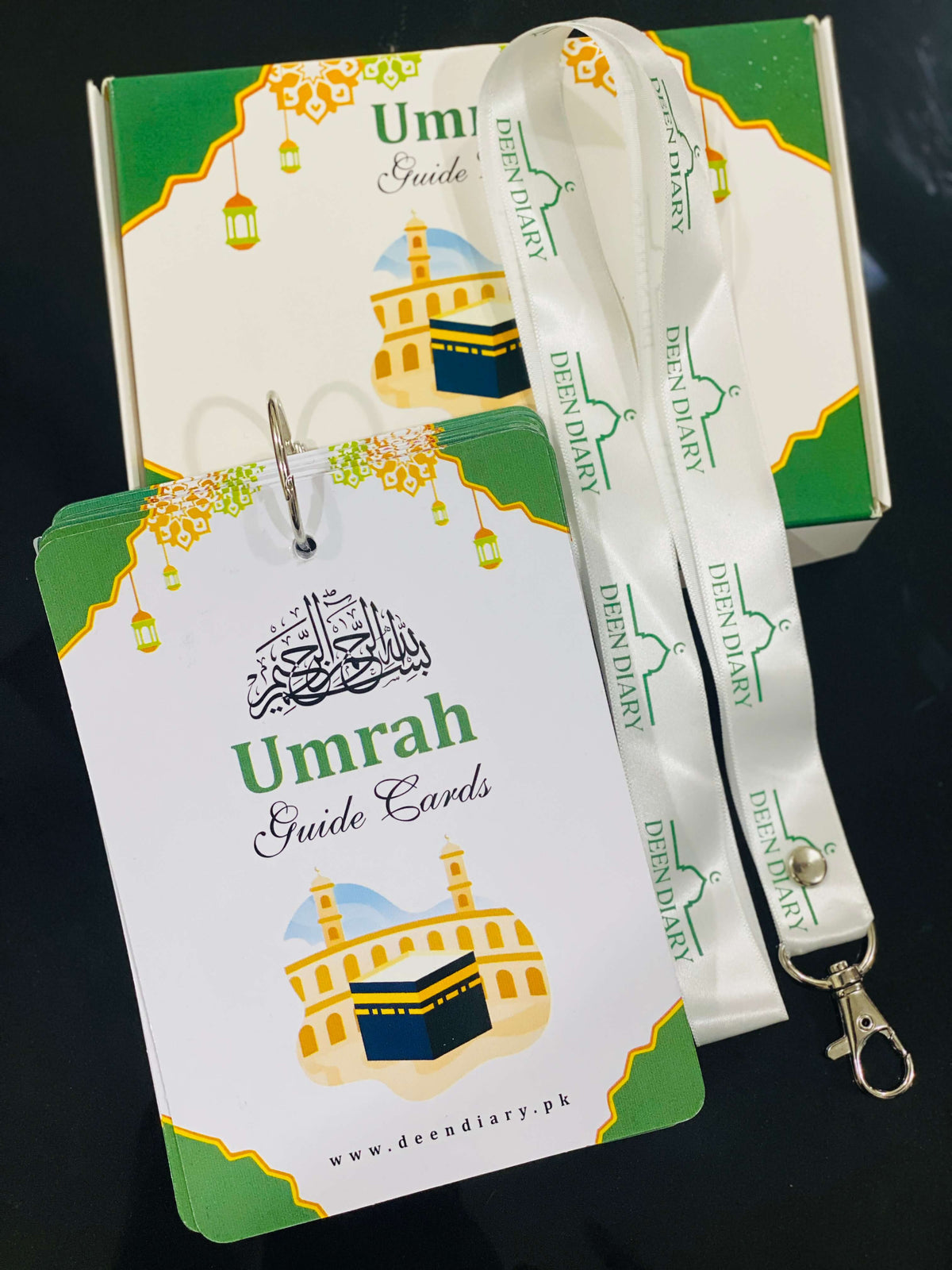 Umrah Guide Cards box with Kaaba design and lanyard, step-by-step Umrah guide in Urdu and English
